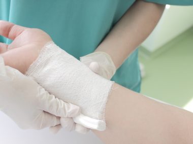 Doctor imposes bandage. Documentary photo